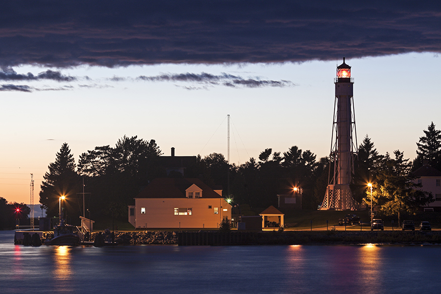 Client Center - Sturgeon Bay Ship Canal Lighthouse at Dusk, Lights Reflecting off the Water